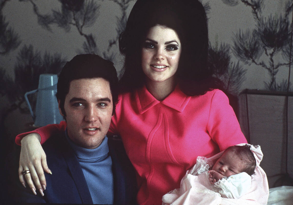 FILE -Elvis Presley poses with wife Priscilla and daughter Lisa Marie, in a room at Baptist hos ...