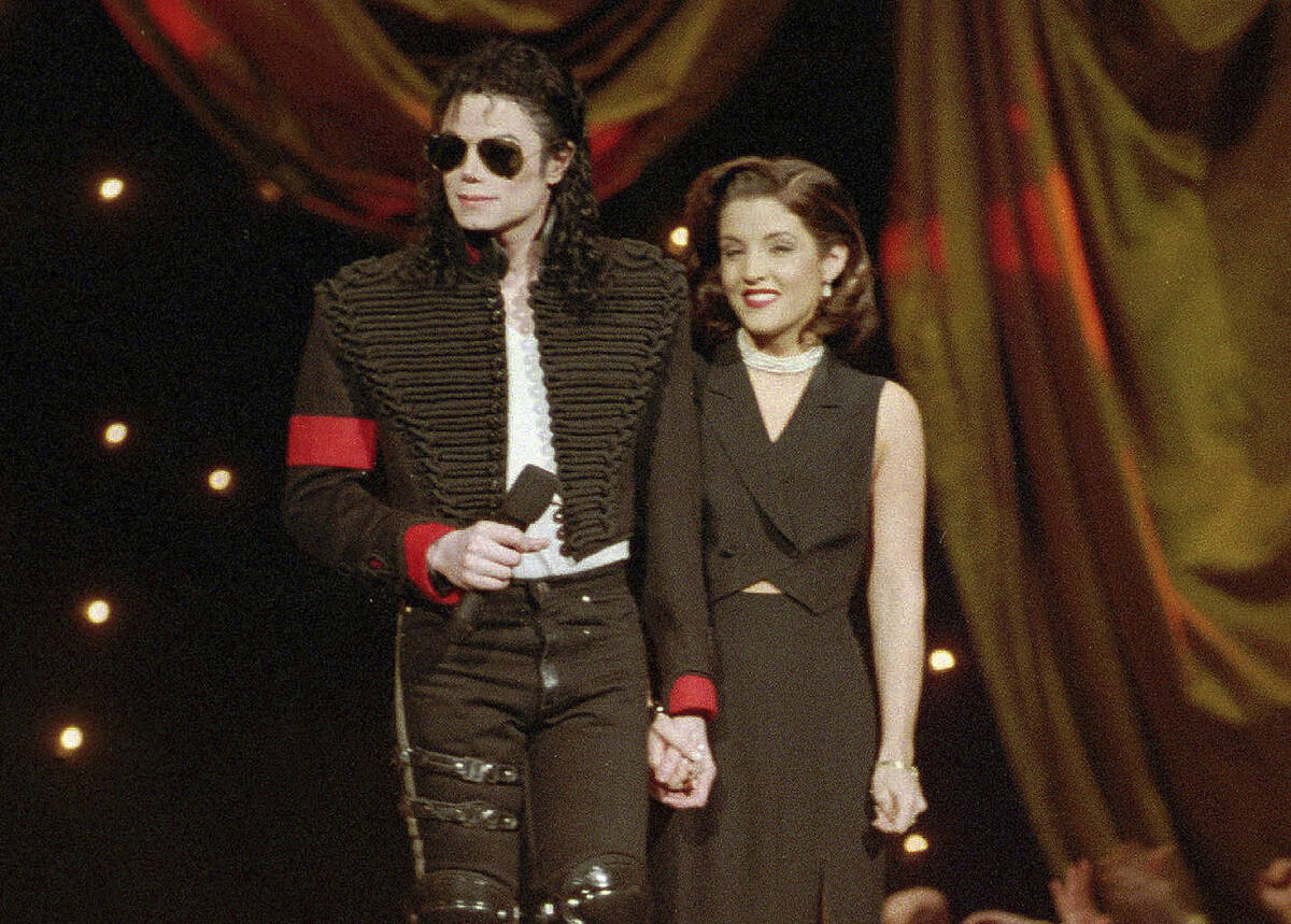 FILE - Michael Jackson and Lisa Marie Presley-Jackson acknowledge applause from the audience af ...