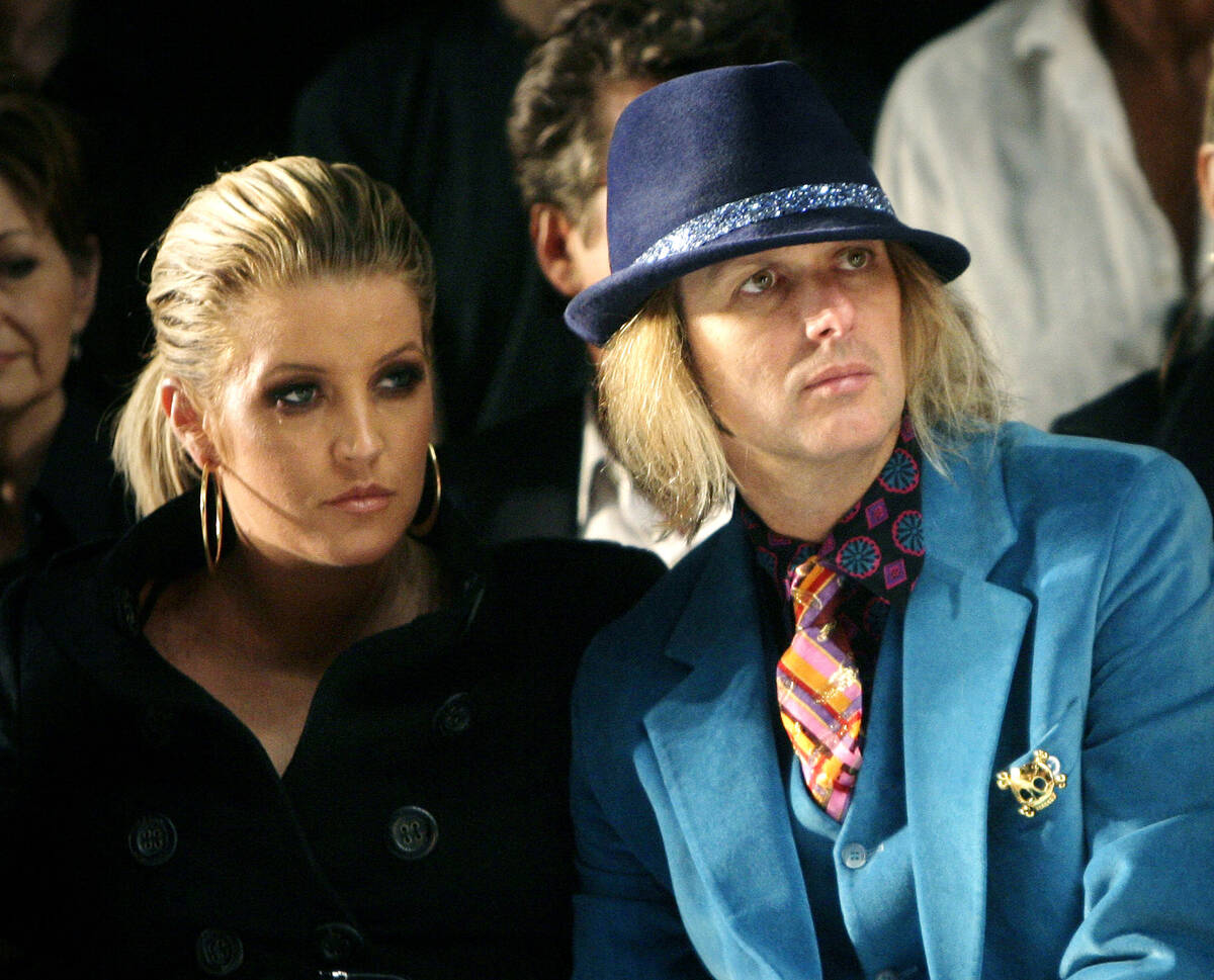 FILE - Lisa Marie Presley and her husband, Michael Lockwood, watch the Anna Sui 2008 spring/sum ...