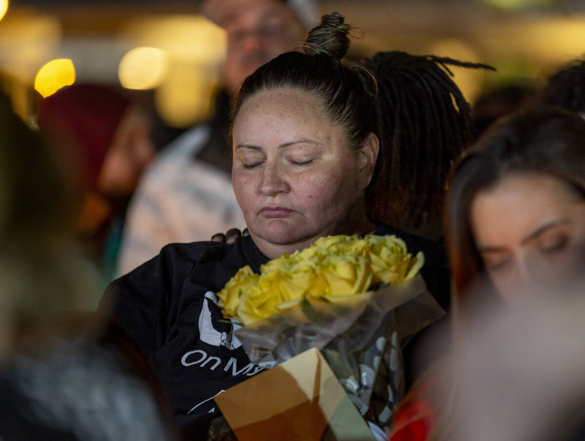 Angela Dominguez is moved while hearing kind words spoken of her husband Jonet Dominguez during ...