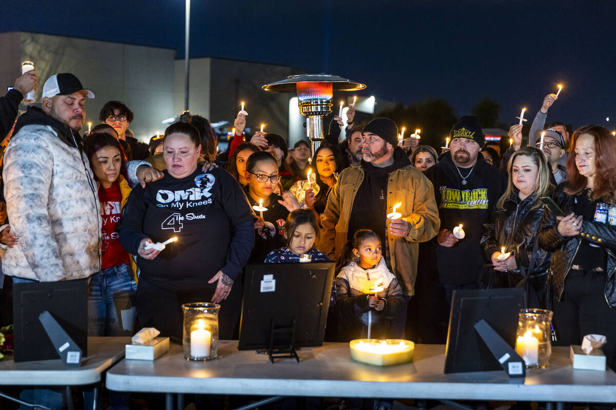 Family and friends of Jonet Dominguez honor him during a candlelight vigil at Awaken Las Vegas ...
