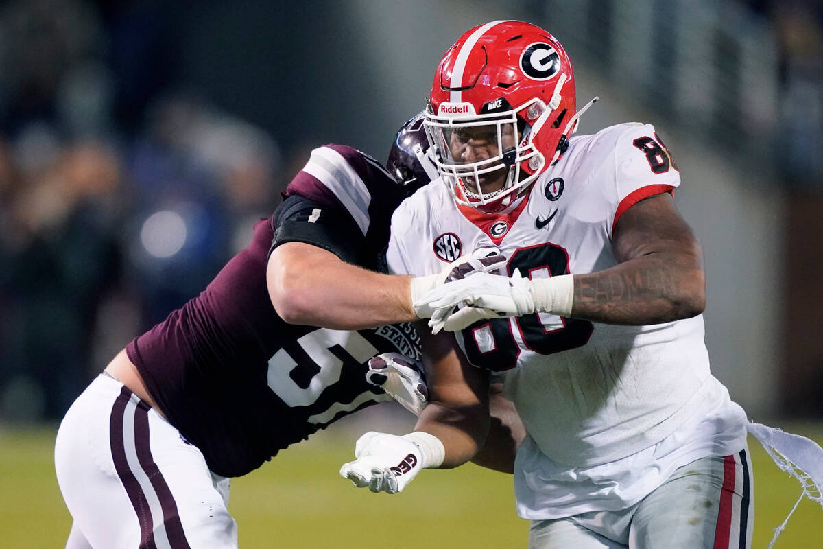 Georgia defensive lineman Jalen Carter (88) pushes past a block by Mississippi State offensive ...