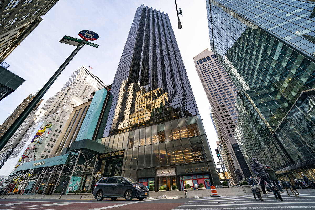 FILE - Pedestrians cross Fifth Avenue in front of Trump Tower, Wednesday, Feb. 17, 2021, in New ...