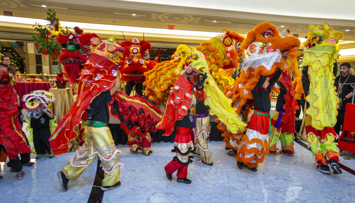 The Lohan School of Shaolin conduct a lion dance at a reception as the Grand Canal Shoppes cele ...