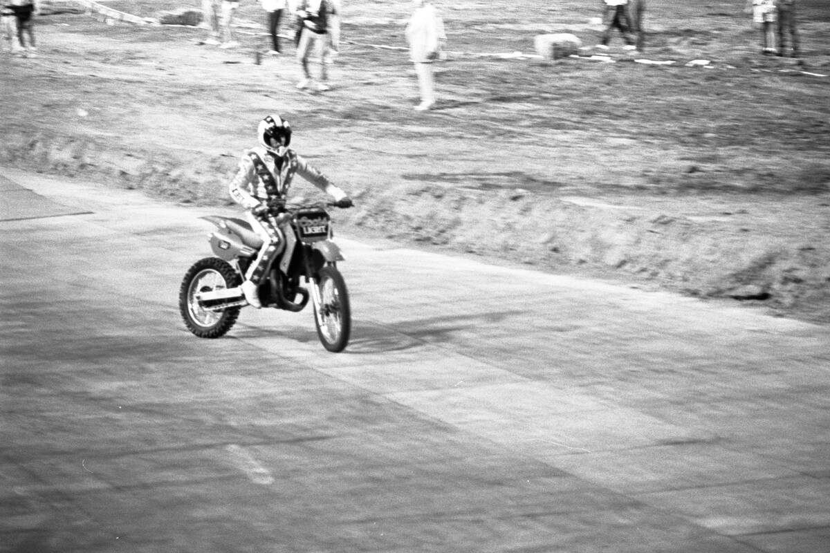 Robbie Knievel jumps his motorcycle 153 1/2 feet over 22 parked cars in May 1987 at Sam Boyd St ...