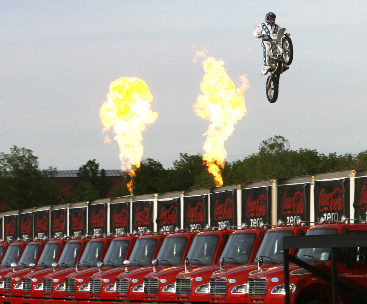 Daredevil Robbie "Kaptain" Knievel jumps over 24 delivery trucks, his longest gap eve ...