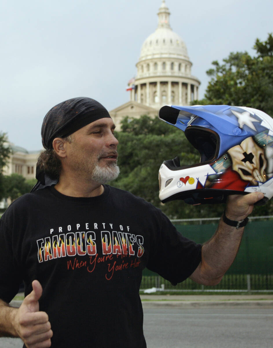 Stunt motorcyclist Robbie Knievel pauses in front of the Capitol before his scheduled jump Frid ...