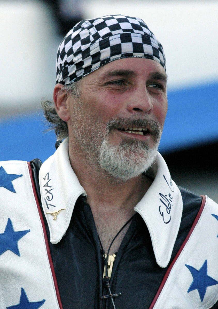 Robbie Knievel appears after his motorcycle jump before the start of the IRL Firestone 550 auto ...