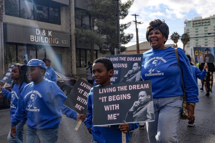 Kids from Wendell P. Williams Elementary School walk in the 41st annual Martin Luther King Jr. ...