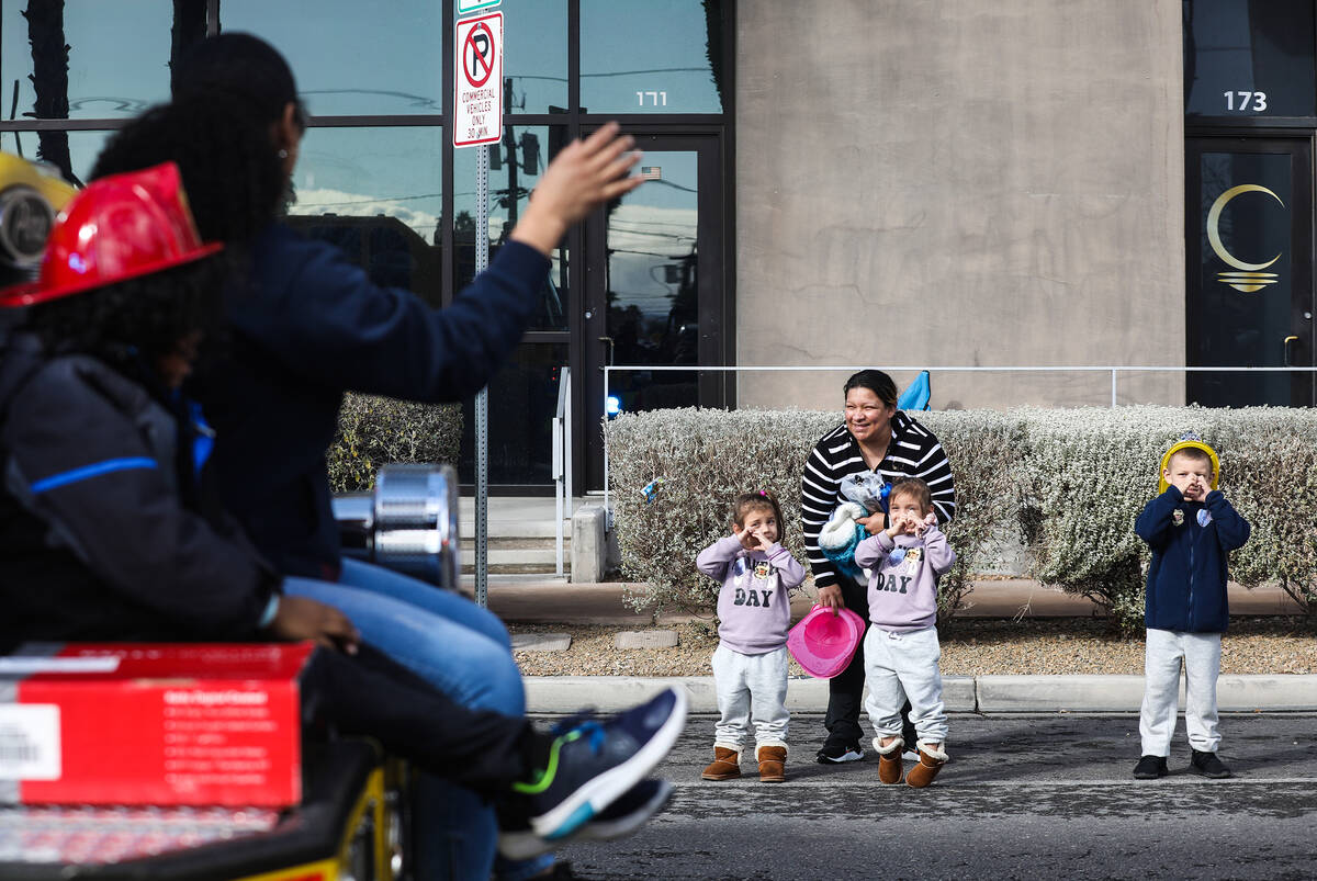 Diana Pedraza, center, stands with her twin daughters, Ava and Anaya Pedraza, 2, and her son Mi ...