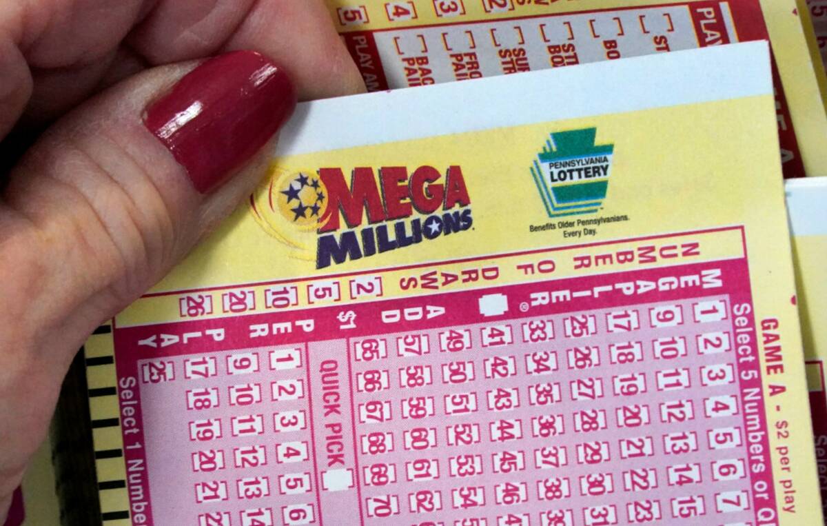 A Mega Millions entry card is displayed at the Cranberry Super Mini Mart in Cranberry, Pa., Thu ...