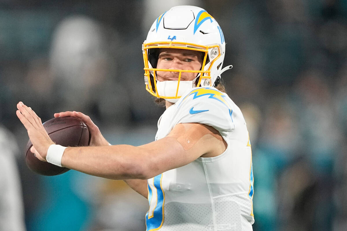 Los Angeles Chargers quarterback Justin Herbert (10) warms up before an NFL wild-card football ...
