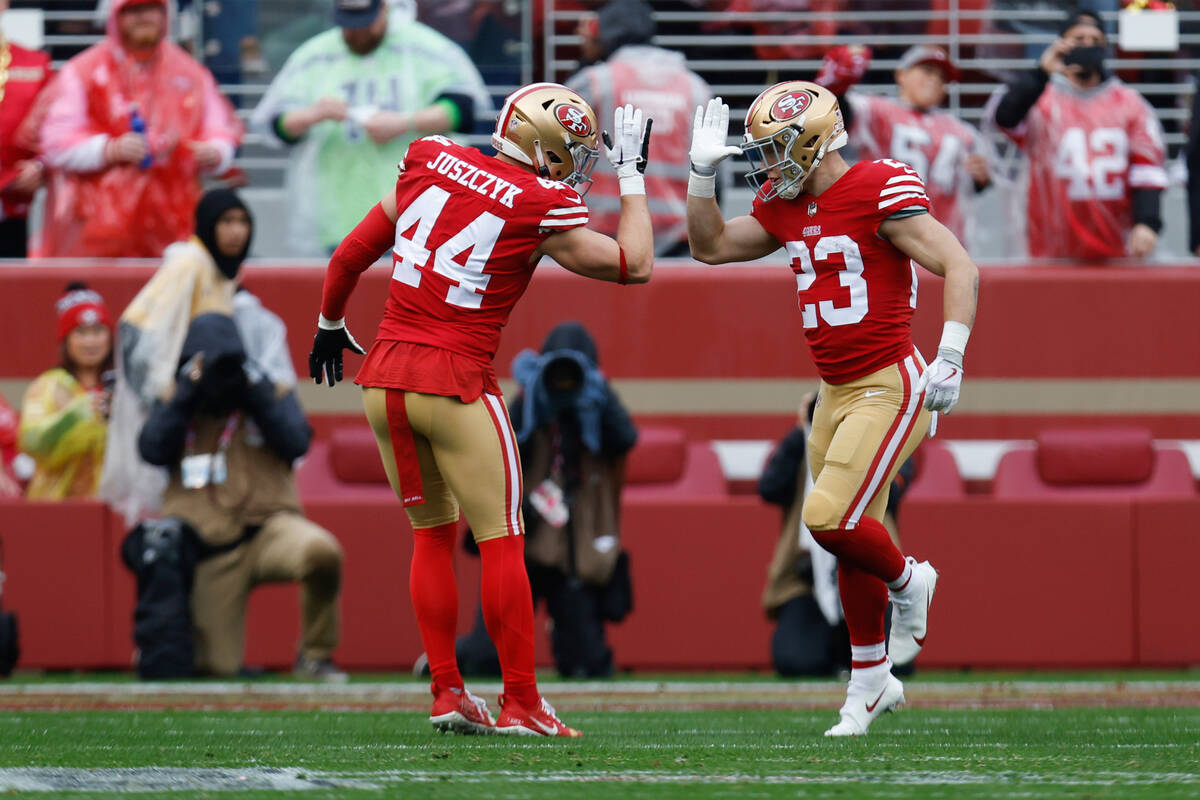 San Francisco 49ers running back Christian McCaffrey (23) is congratulated by fullback Kyle Jus ...