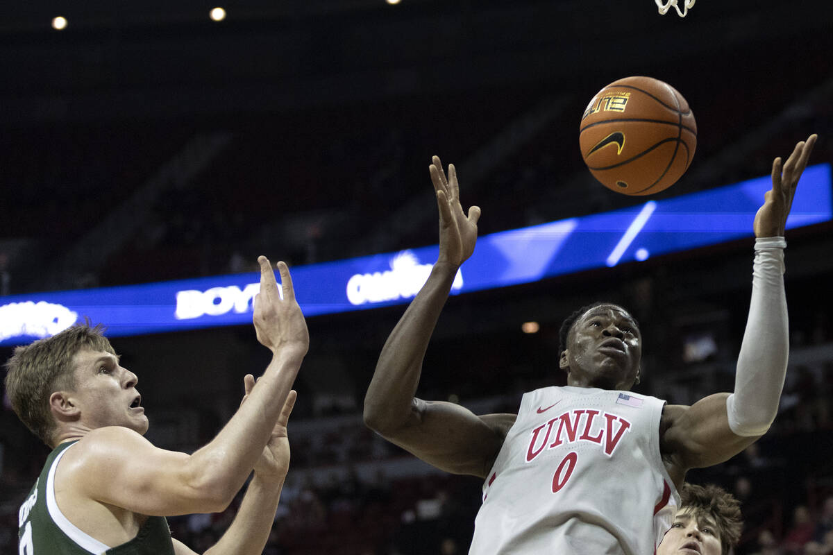 UNLV Rebels forward Victor Iwuakor (0) goes to catch a rebound against Colorado State Rams forw ...