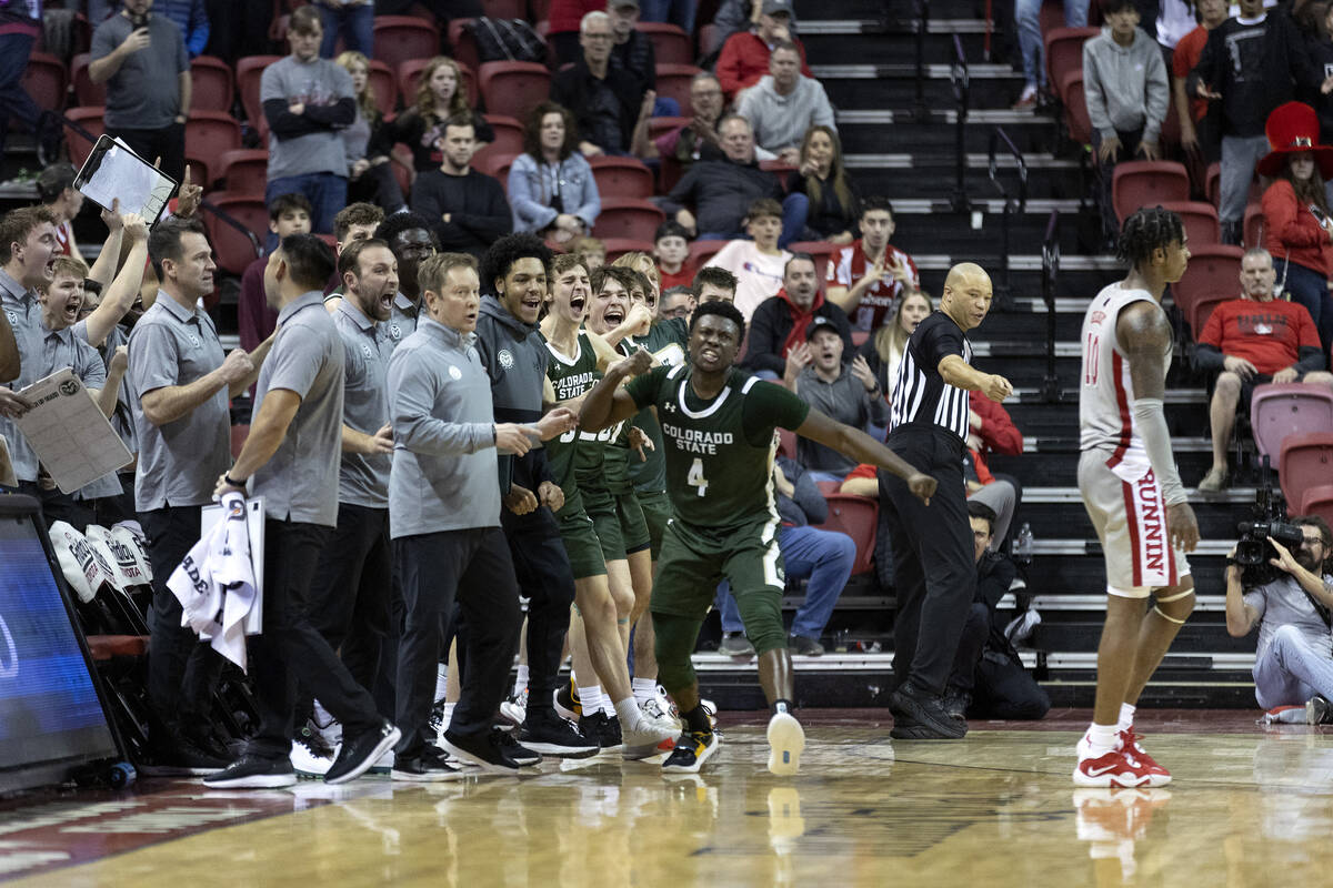 Colorado State Rams guard Isaiah Stevens (4) and the Rams’ bench go wild after referees ...