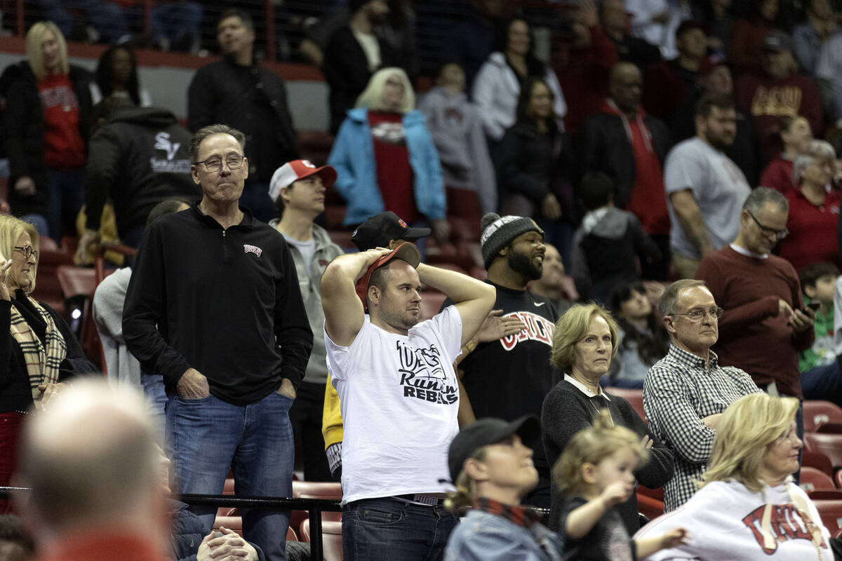 UNLV fans react after a foul is called on their team during the final seconds in overtime of an ...