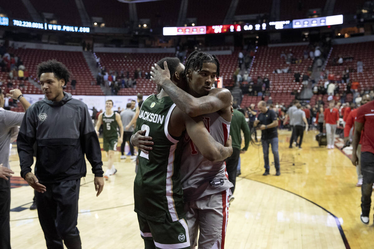 UNLV Rebels guard Keshon Gilbert (10) embraces Colorado State Rams guard Taviontae Jackson (2) ...