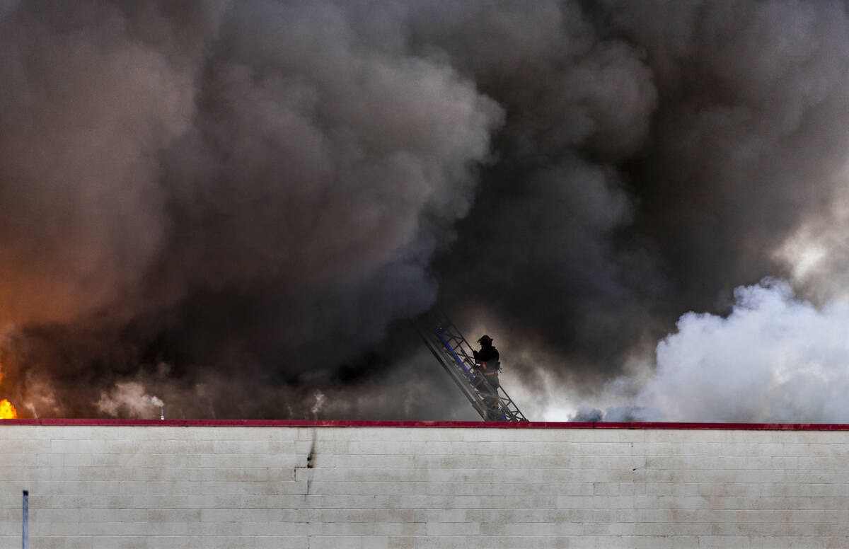 Las Vegas and Clark County Fire works a fully involved former Kmart store at 2975 E. Sahara Ave ...