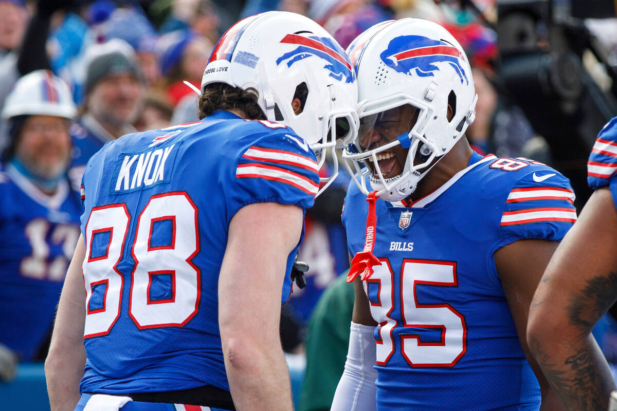Buffalo Bills tight end Dawson Knox (88) and tight end Quintin Morris (85) celebrate after a to ...