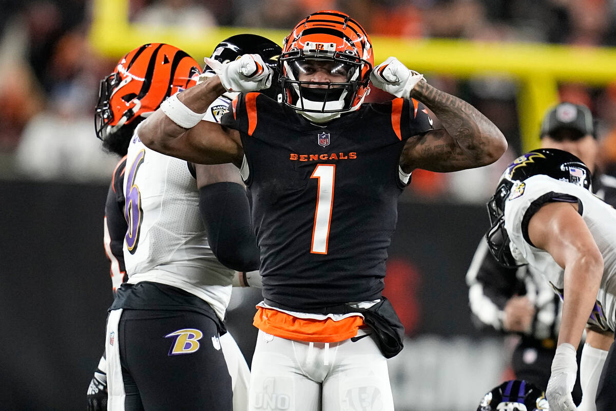 Cincinnati Bengals wide receiver Ja'Marr Chase celebrates a first down in the first half of an ...