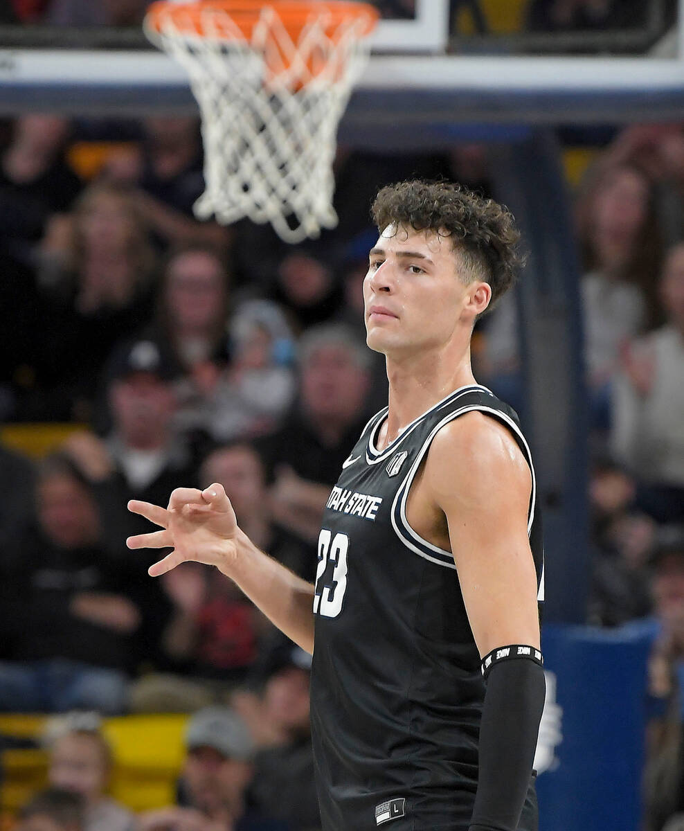 Utah State forward Taylor Funk (23) celebrates after making a 3-pointer against UNLV during the ...