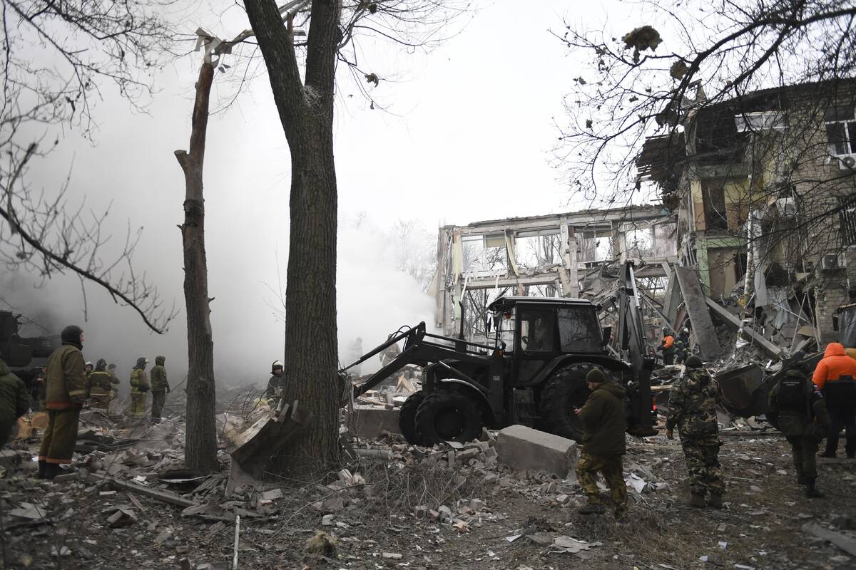 Donetsk's emergency employees work at a site of a shopping center destroyed after what Russian ...