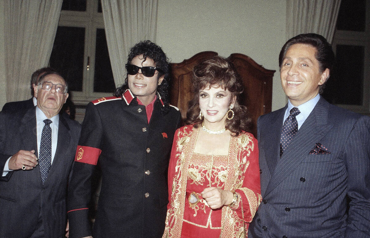 FILE - U.S. pop superstar Michael Jackson poses with Italian actress Gina Lollobrigida and fash ...