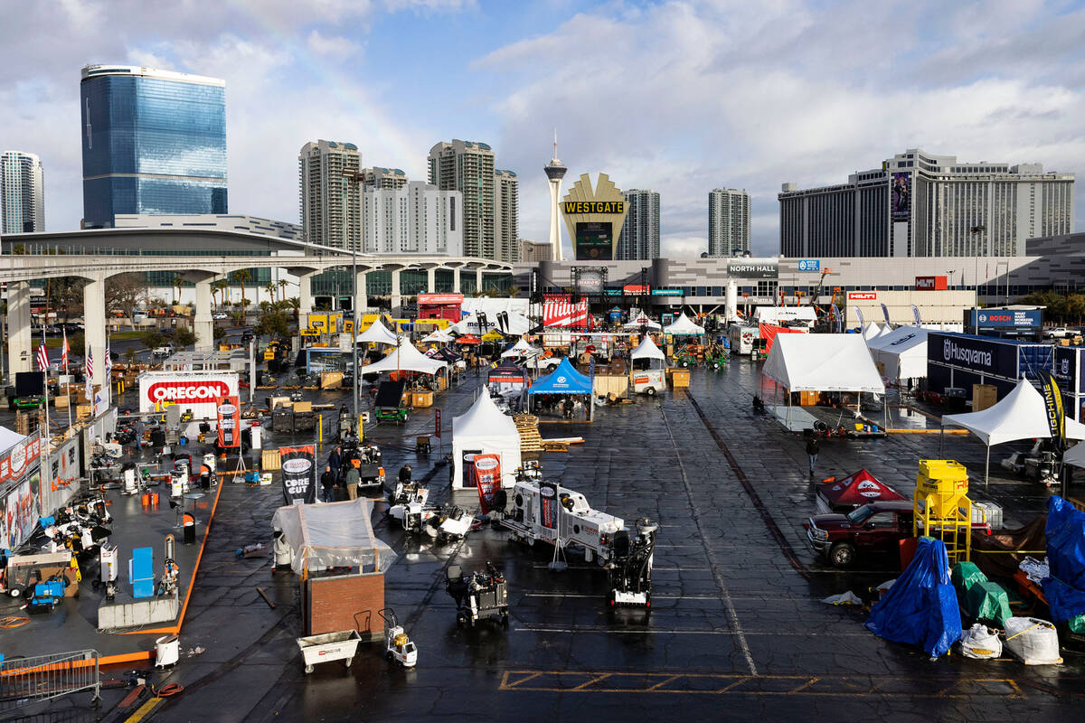 Workers prepare by building temporary structures for World of Concrete 2023 at the Las Vegas Co ...