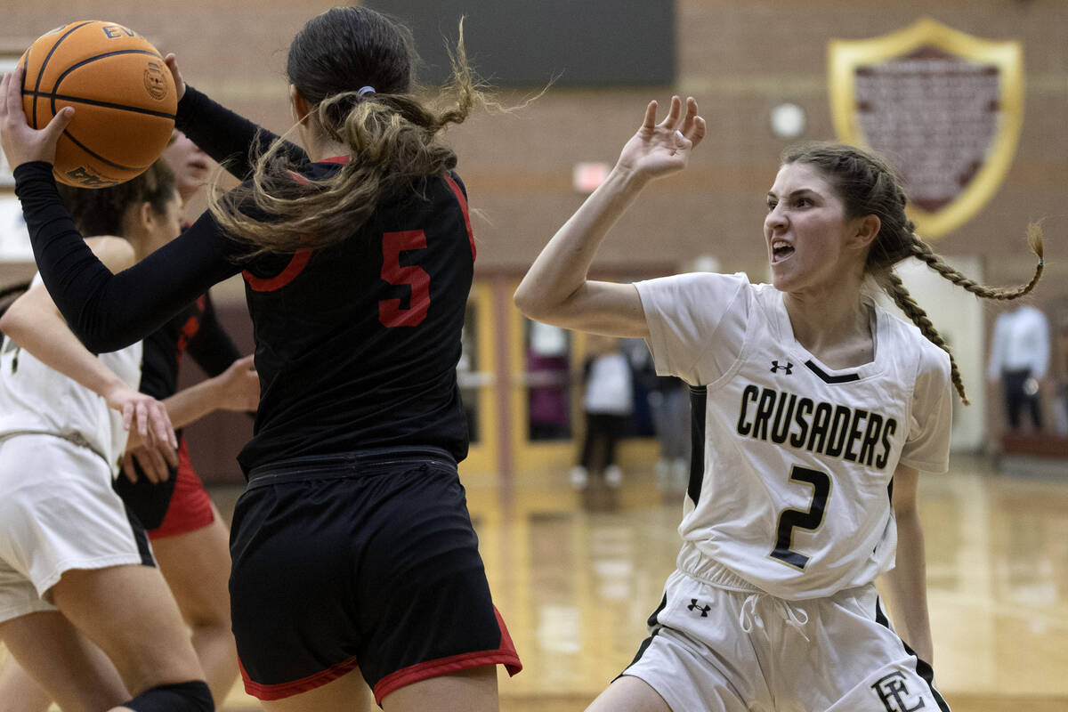 Coronado’s Scarlet Lopez (5) snags a rebound while Faith Lutheran’s Abby Blake (2 ...