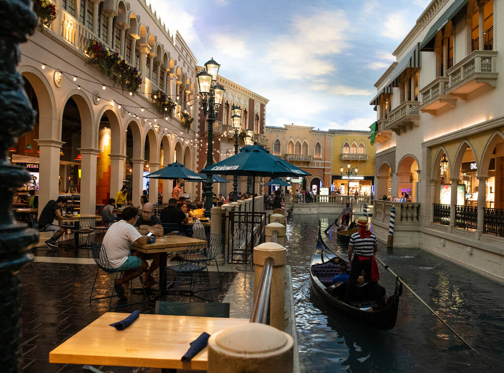 Tourists take a gondola ride in the Grand Canal at the Venetian hotel-casino on the Las Vegas S ...