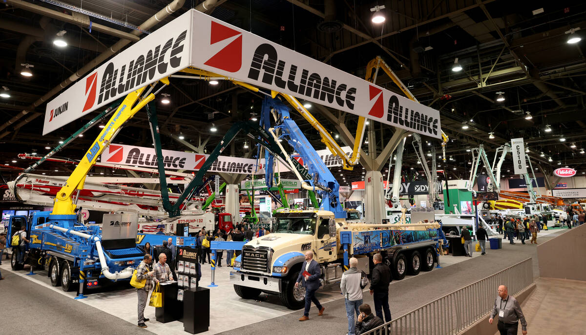 Conventioneers check out concrete pumping rigs on Day 1 of World of Concrete at the Las Vegas C ...
