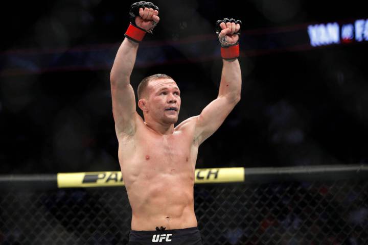 Petr Yan celebrates after defeating Urijah Faber in a mixed martial arts bantamweight bout at U ...