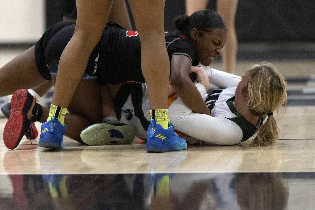 Las Vegas’ Jaidyn Savoy, top, fights for the ball with Palo Verde’s Halle McKnigh ...