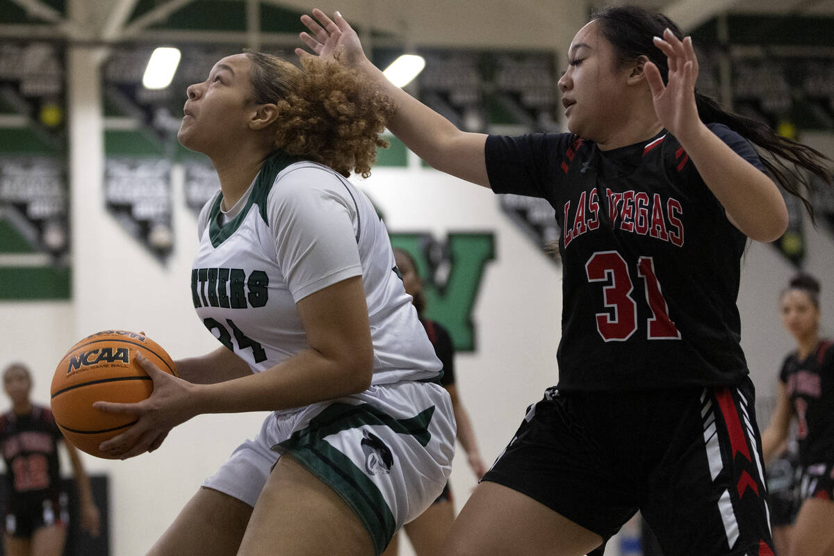 Palo Verde’s Aliah Jackson, left, shoots against Las Vegas’ Rhanaiya Guido (31) d ...