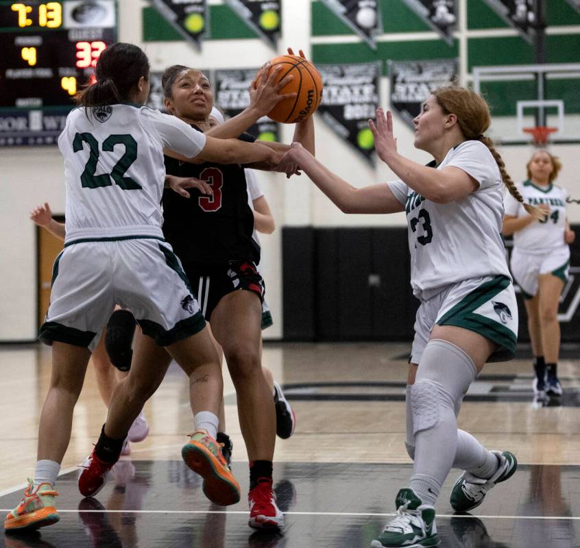 Las Vegas’ Vernonie Newson (3) drives toward the hoop against Palo Verde’s Sophia Rivera (2 ...