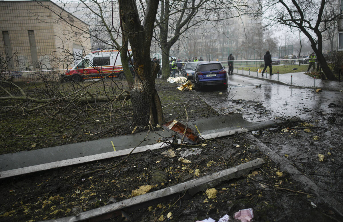 A helicopter blade on the ground at the scene where a helicopter crashed on civil infrastructur ...
