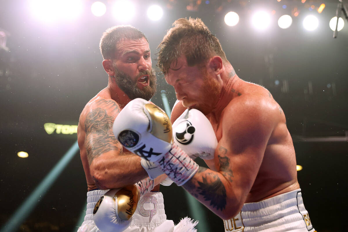 Caleb Plant, left, connects a punch against Saul “Canelo” Alvarez in the fifth round of a s ...
