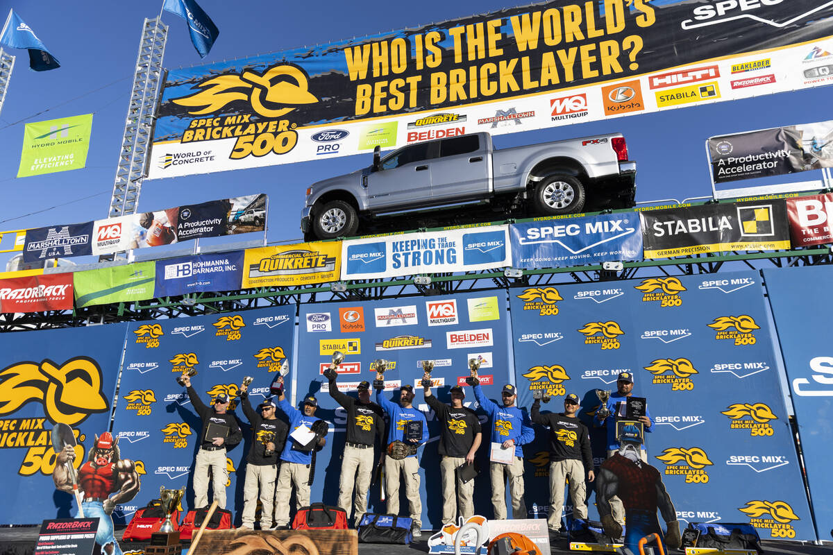 Winners in the World of Concrete Convention bricklaying competition pose for photos at the Las ...