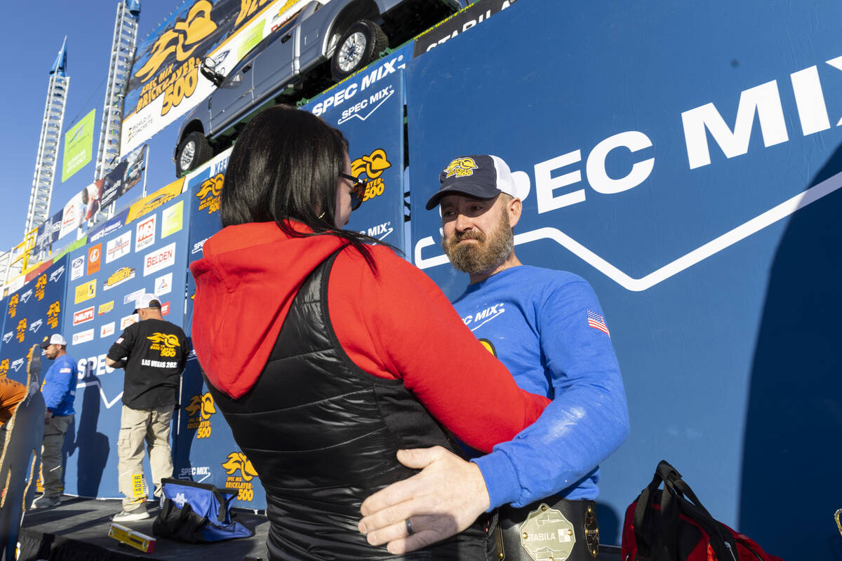 Michael Schlund, right, with his wife Kara, embrace after his win in the World of Concrete Conv ...
