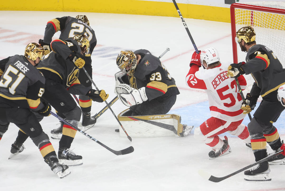 Golden Knights goaltender Adin Hill (33) stops the puck during the first period of an NHL hocke ...