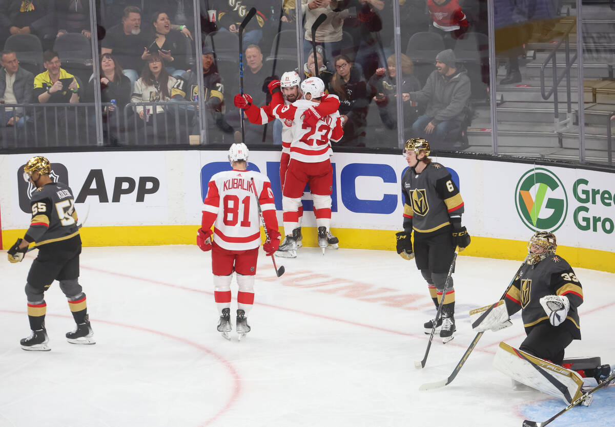 Detroit Red Wings left wing Lucas Raymond (23) celebrates his goal with center Dylan Larkin (71 ...