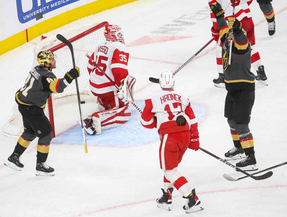 Vegas Golden Knights center William Karlsson, right, scores a goal against Detroit Red Wings go ...