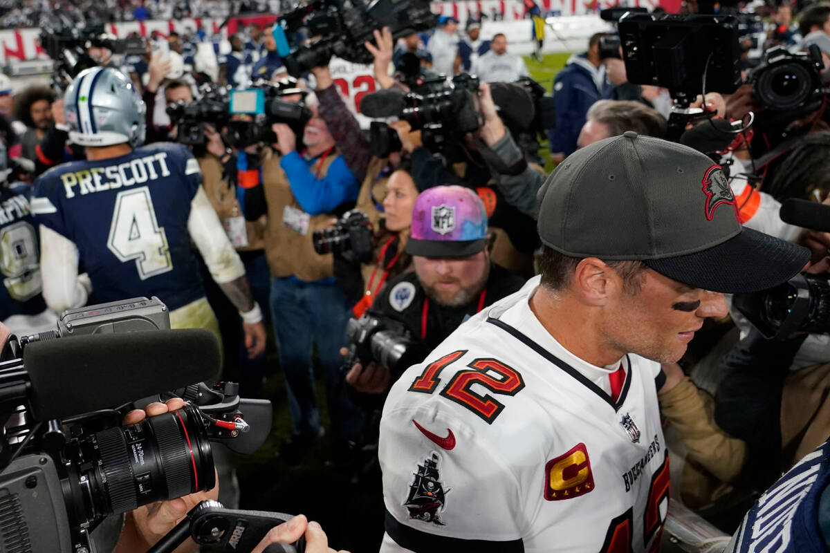 Tampa Bay Buccaneers quarterback Tom Brady (12) leaves the field after speaking with Dallas Cow ...