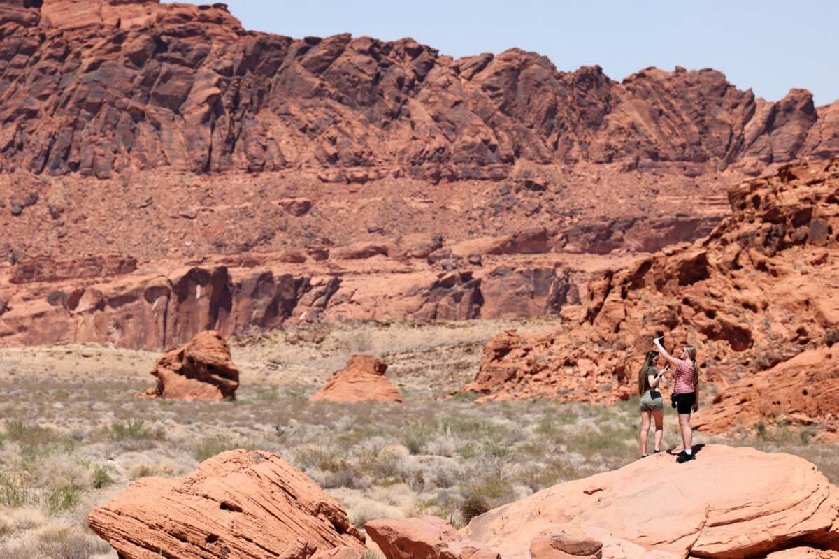 Few people brave the heat to get photos at Valley of Fire State Park northeast of Las Vegas Wed ...