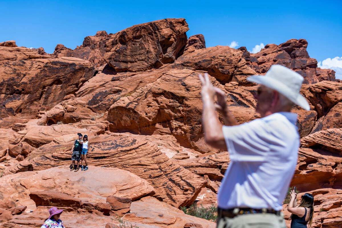 Visitors take in the Beehives rock formations in the Valley of Fire State Park on Tuesday, June ...