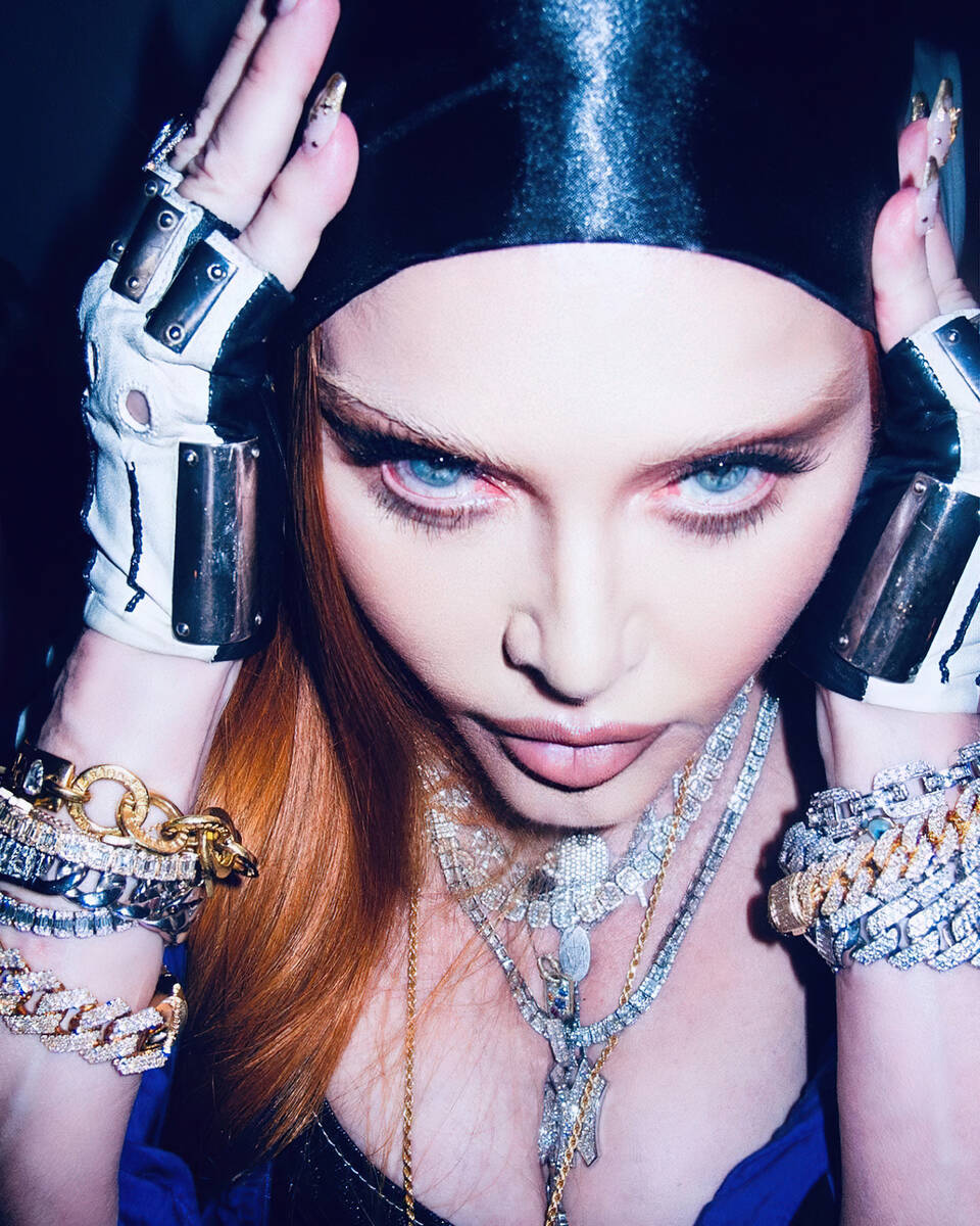 Madonna, shown in a promotional photo, has added 13 dates — including a second show at T-Mobi ...