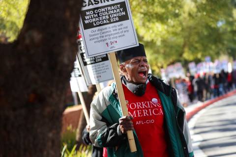Culinary Workers Union Local 226 committee leader Henry Anthony Joyner pickets outside of Stati ...
