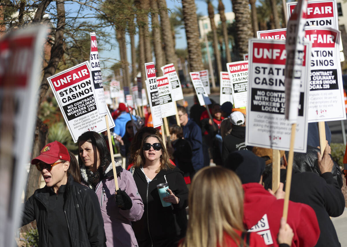 Culinary Local 226 members picket outside of Station Casinos headquarters on Thursday, Jan. 19, ...
