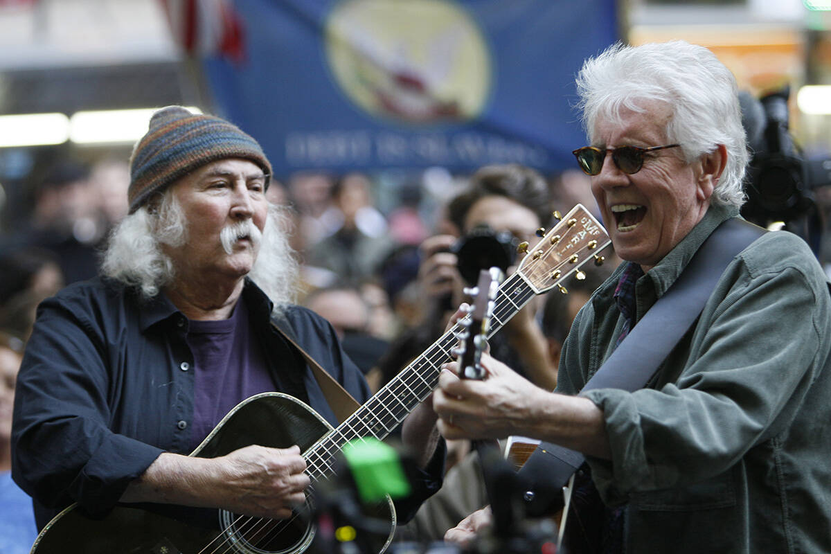 FILE - In this Nov. 8, 2011 file photo, singers David Crosby, left, and Graham Nash perform at ...