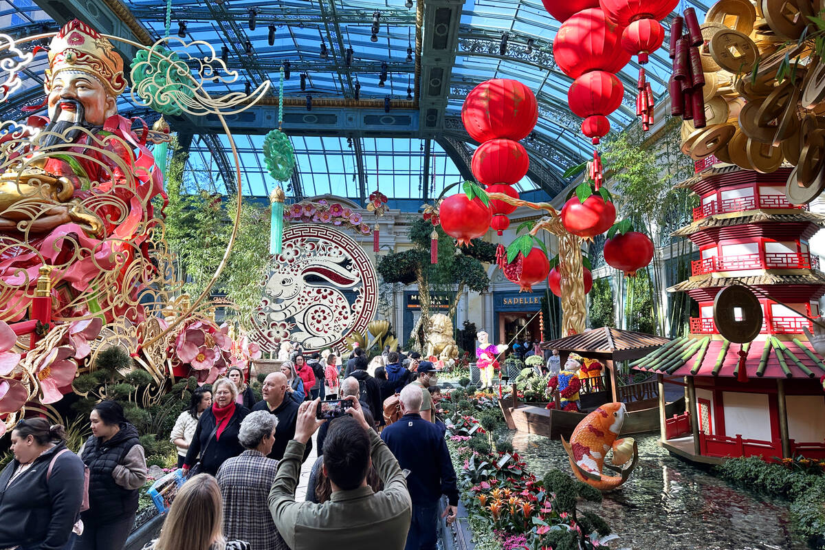 Guest walk through the Year of the Rabbit display celebrating Lunar New Year at the Bellagio Co ...